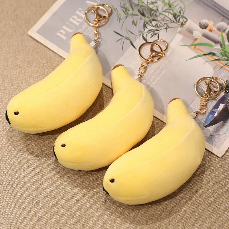 Cute yellow banana seal plush keychain, soft PP cotton, hypoallergenic, perfect gift.
