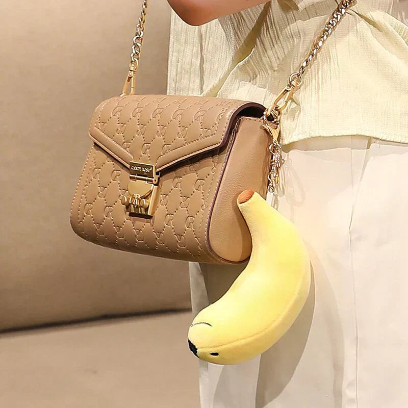 Cute yellow banana seal plush toy keychain, soft PP cotton, hypoallergenic, perfect gift.