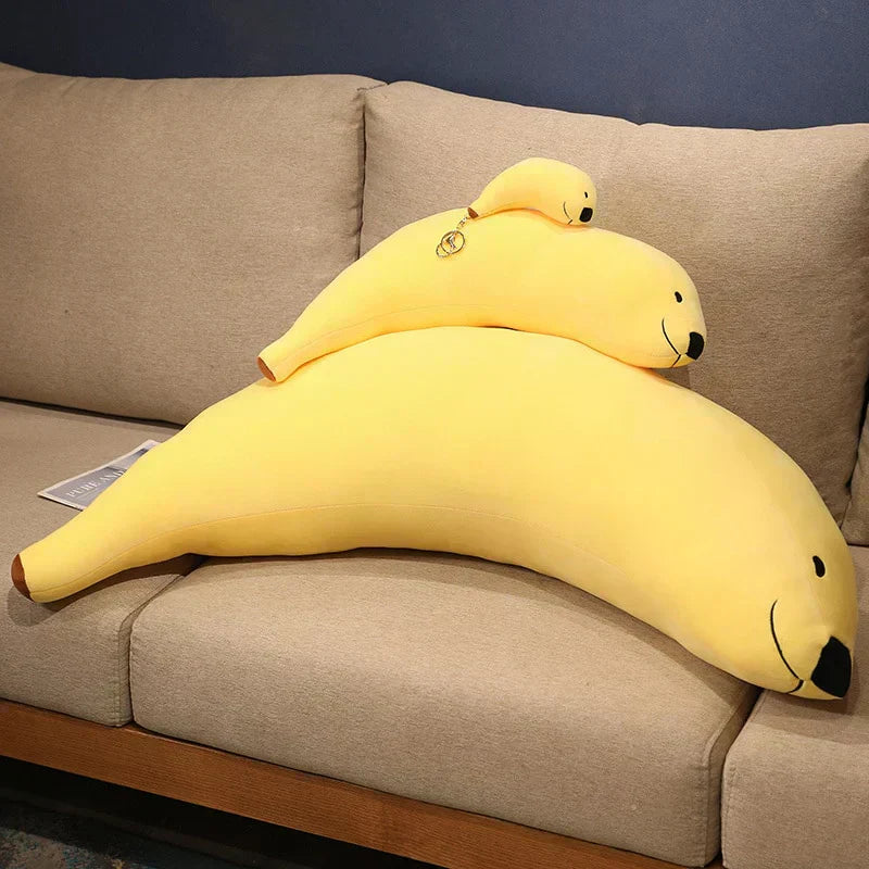 Adorable yellow banana-shaped seal plush toy, made of soft PP cotton, perfect for cuddling.  Hypoallergenic & ethically sourced.