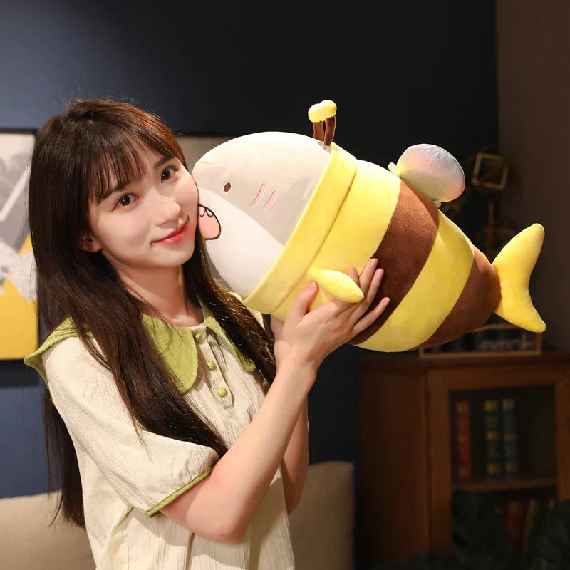 Cute bee shark plush toy; soft, cuddly, with glittery wings.  Premium PP cotton filling.  Available in multiple sizes.
