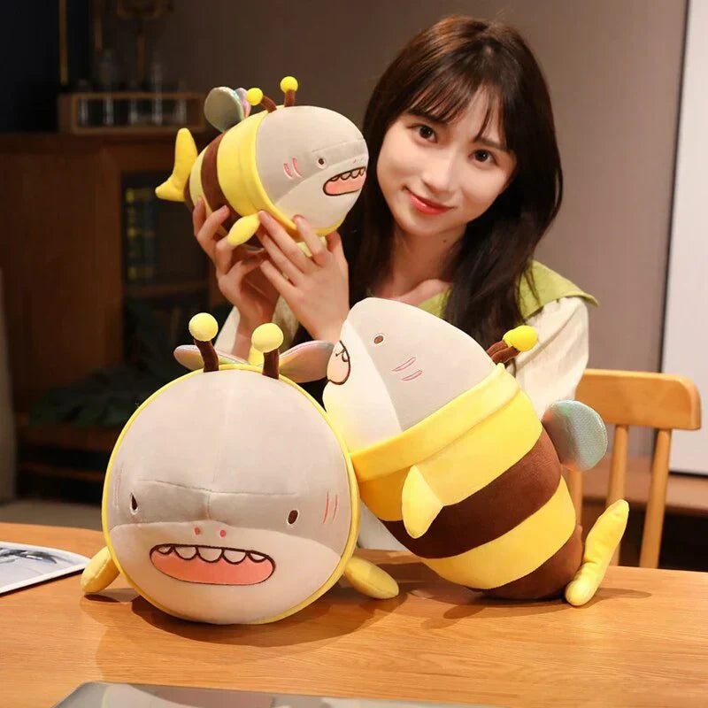 Cute plush bee shark toy with glittery wings, soft plush material, and PP cotton filling. Available in various sizes.