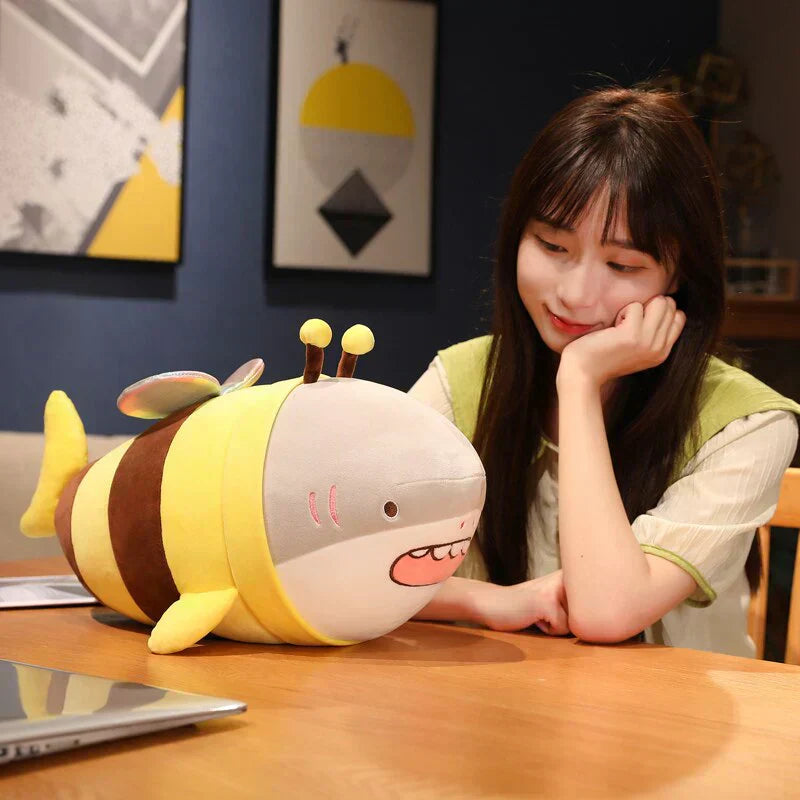 Cute plush bee shark toy with soft plush material, glittery wings, and PP cotton filling.  Available in multiple sizes.