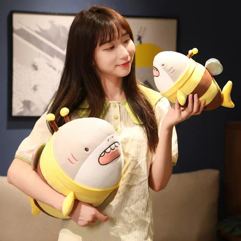 Adorable plush bee shark toy with glittery wings, soft PP cotton filling, and cute design.  Available in various sizes.