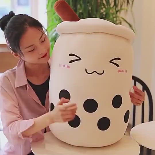 Adorable beige bubble tea plush toy with brown straw, black boba, and happy face; soft PP cotton.