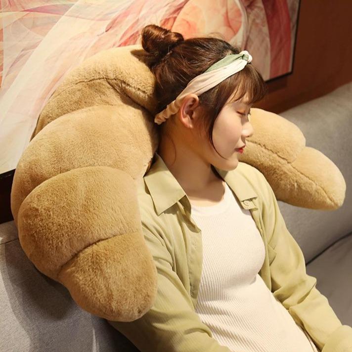 Cute beige curly croissant plush toy, incredibly soft, perfect for cuddling. Made with premium PP cotton.  Multiple sizes available.