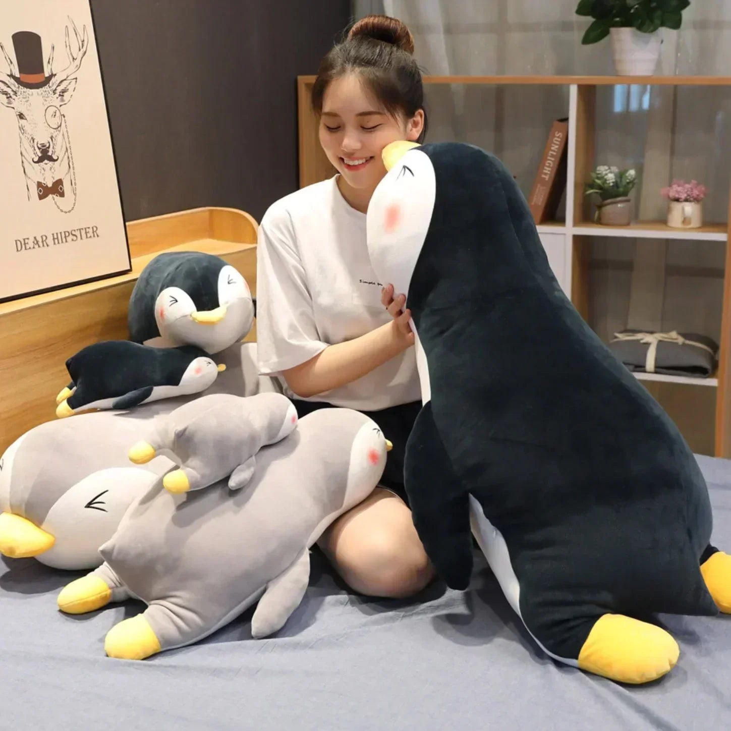 Cute penguin plush pillow in black and gray, made of soft PP cotton.  Multiple sizes available for cozy comfort.