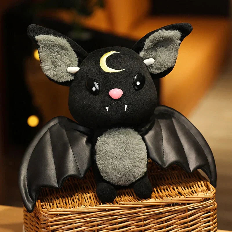 Adorable black kawaii bat plush toy with gray fur, crescent moon detail, faux leather wings, and PP cotton filling.