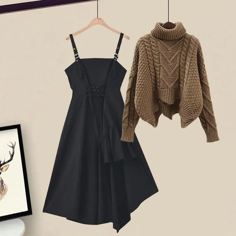 Black polyester midi dress with asymmetrical hem and lace-up back, paired with a brown cable knit turtleneck sweater.