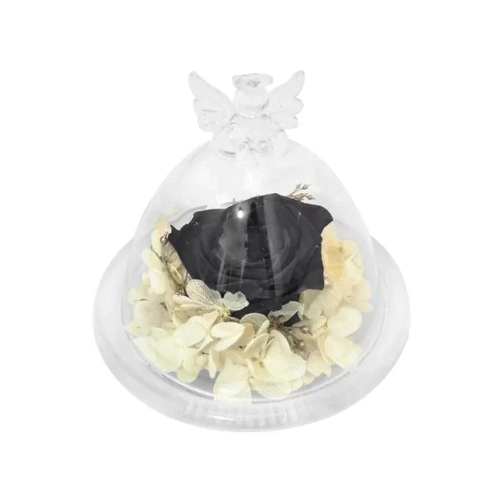 Black preserved rose encased in glass dome with angel wings, nestled on cream hydrangeas.  Elegant décor.