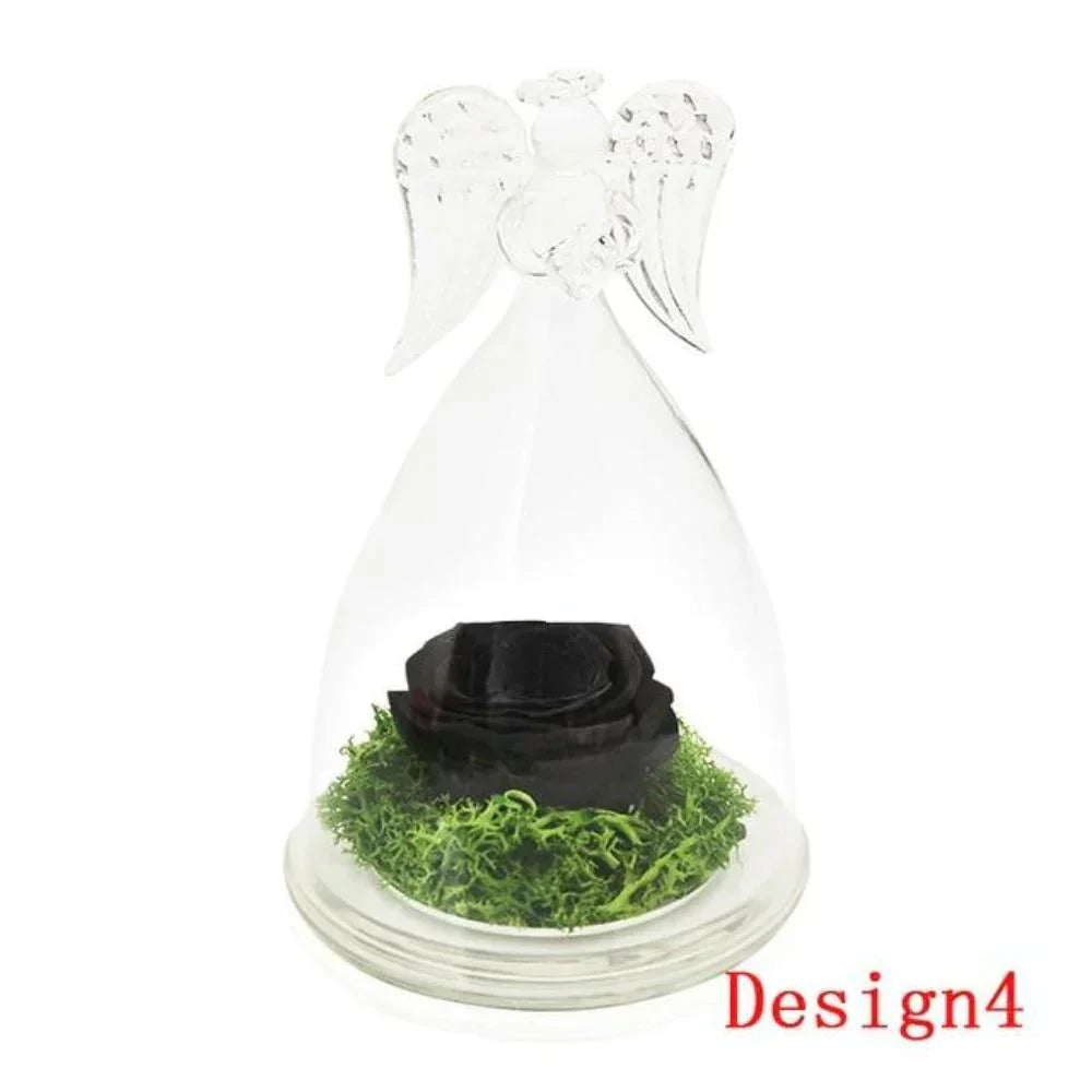 Black preserved rose in glass dome with angel wings, on wooden base.  Lasts 3-5 years.