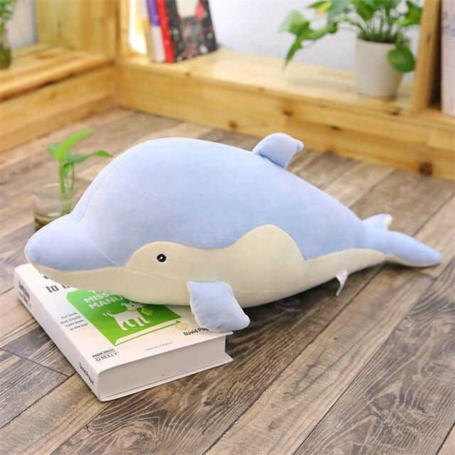 Light blue plush dolphin body pillow; soft PP cotton filling; kawaii style; promotes relaxation and better sleep.