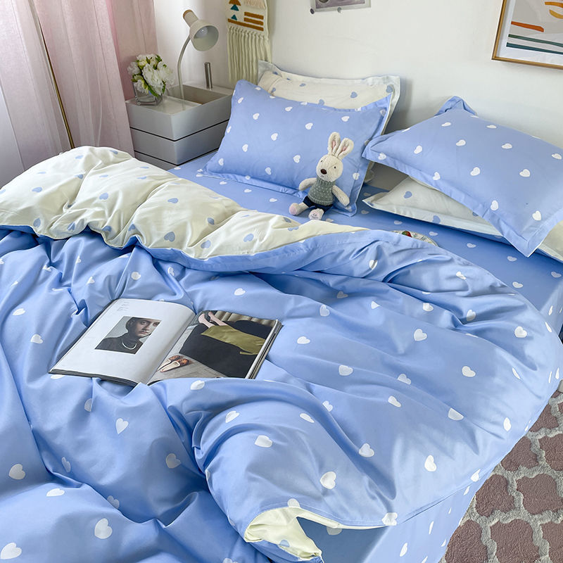 Light blue polyester bedding set with white heart print, includes duvet cover, sheets, and pillowcases.  Multiple sizes available.