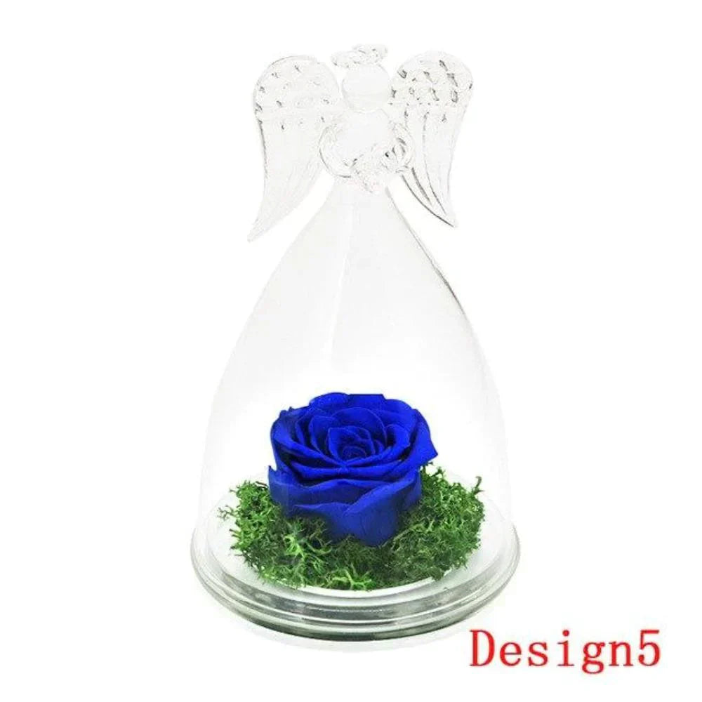 Blue preserved rose in glass dome with angel wings, on wooden base.  Lasts 3-5 years.  Perfect gift.