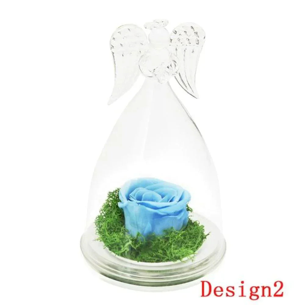 Preserved blue rose in glass dome with angel wings, on wooden base.  Lasts 3-5 years. Perfect gift.