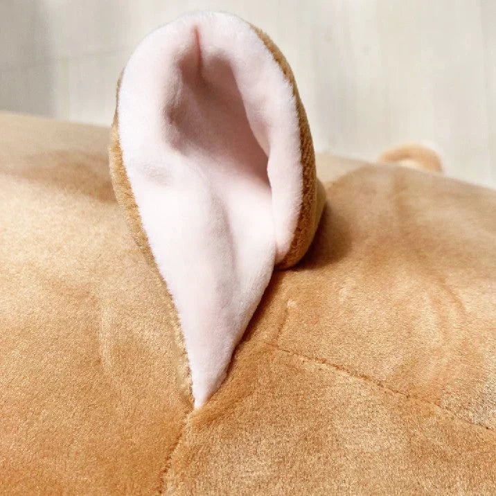Brown plush Chum Chum body pillow with pink inner ear, hypoallergenic PP cotton filling, zipper for cleaning.