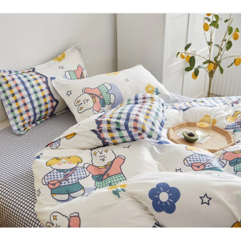 Cute bunny and dog microfiber bedding set; reversible design, features pastel colors, stars, and checkered patterns.  Machine washable.