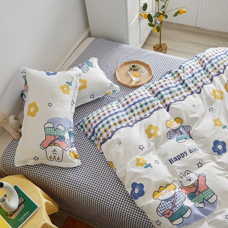 Adorable bunny microfiber bedding set; reversible design with pastel floral and gingham patterns; includes duvet cover, flat sheet, and pillowcases.