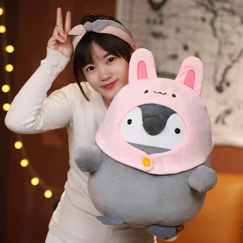 Adorable gray penguin plush toy wearing a pink bunny hood, made of soft PP cotton, hypoallergenic, perfect for cuddling.