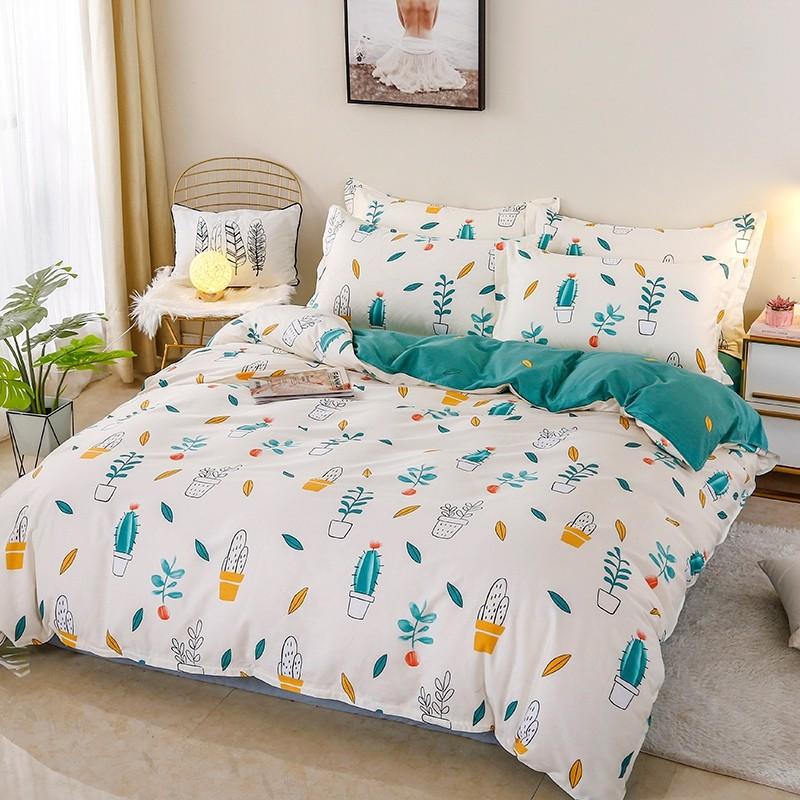Soft, reversible cactus floral bedding set in white, green, and yellow. Premium microfiber, includes duvet cover, sheet, pillowcases.
