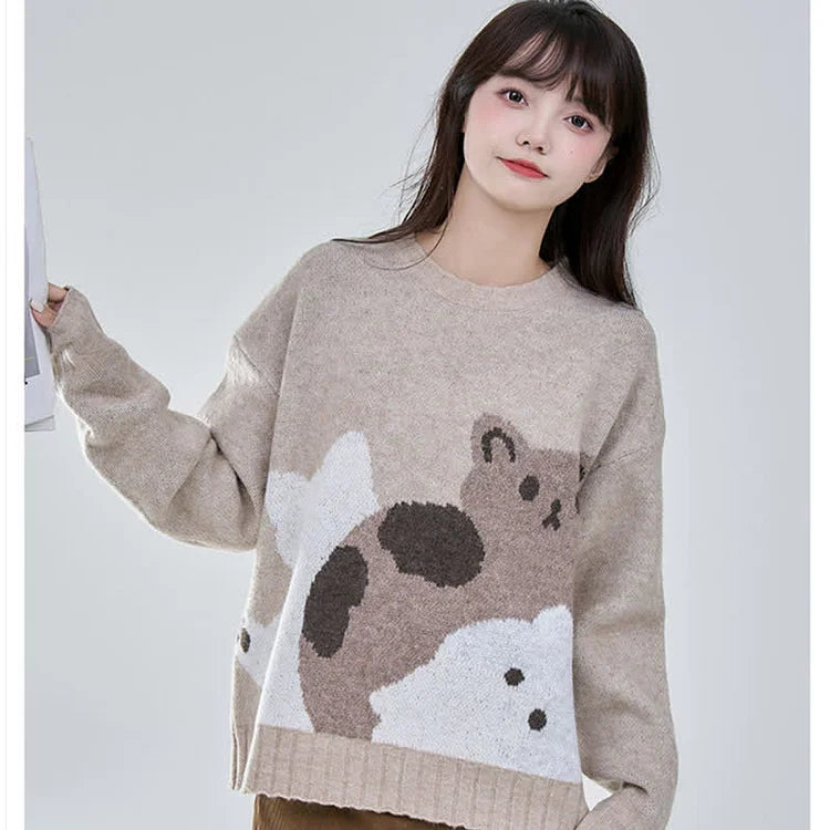 Cozy coffee brown acrylic cat sweater with adorable cartoon cat design, relaxed fit, long sleeves, and crew neck.
