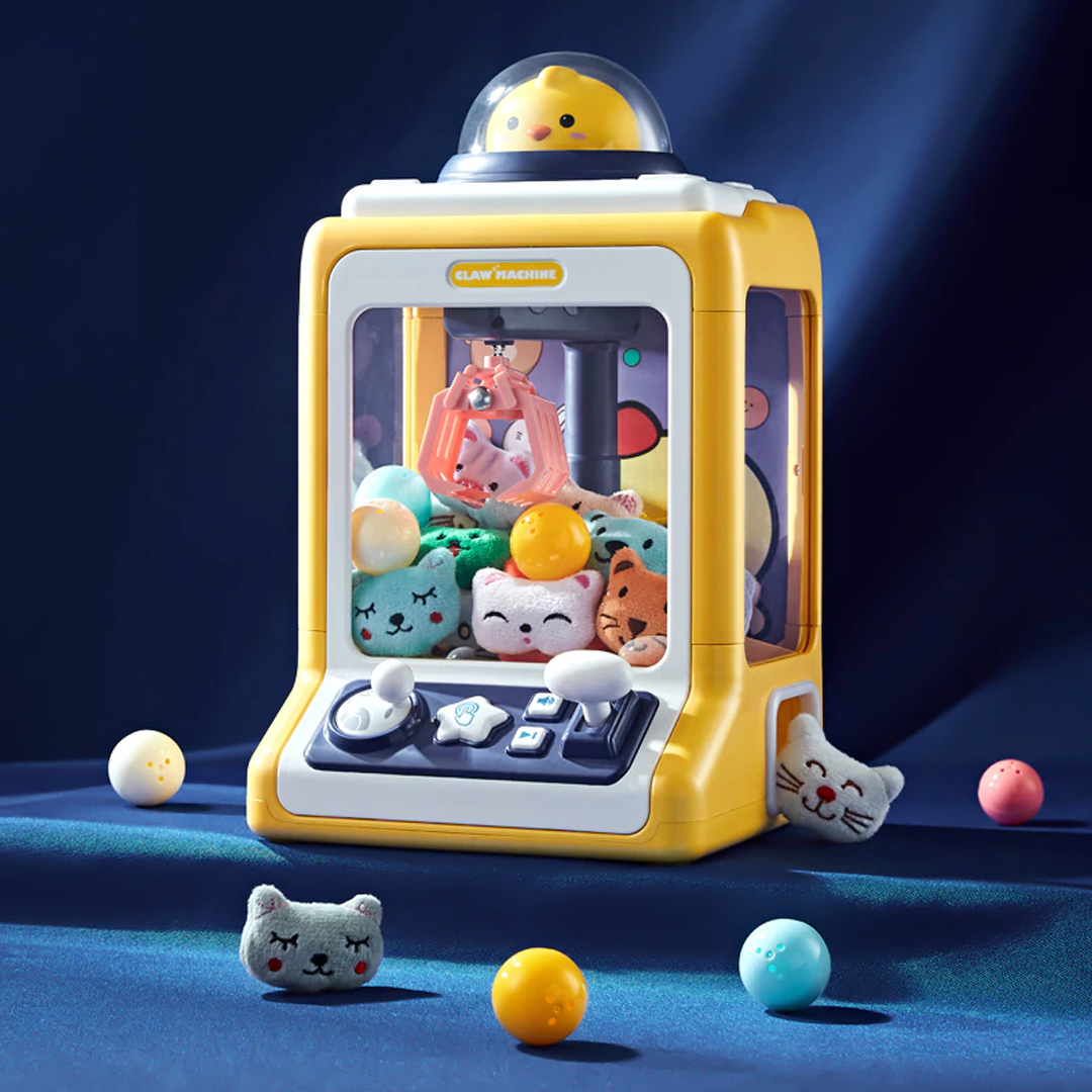 Yellow chick-themed claw machine arcade game with joystick controls, lights, sounds, and includes 10 plush toys & 10 eggs.