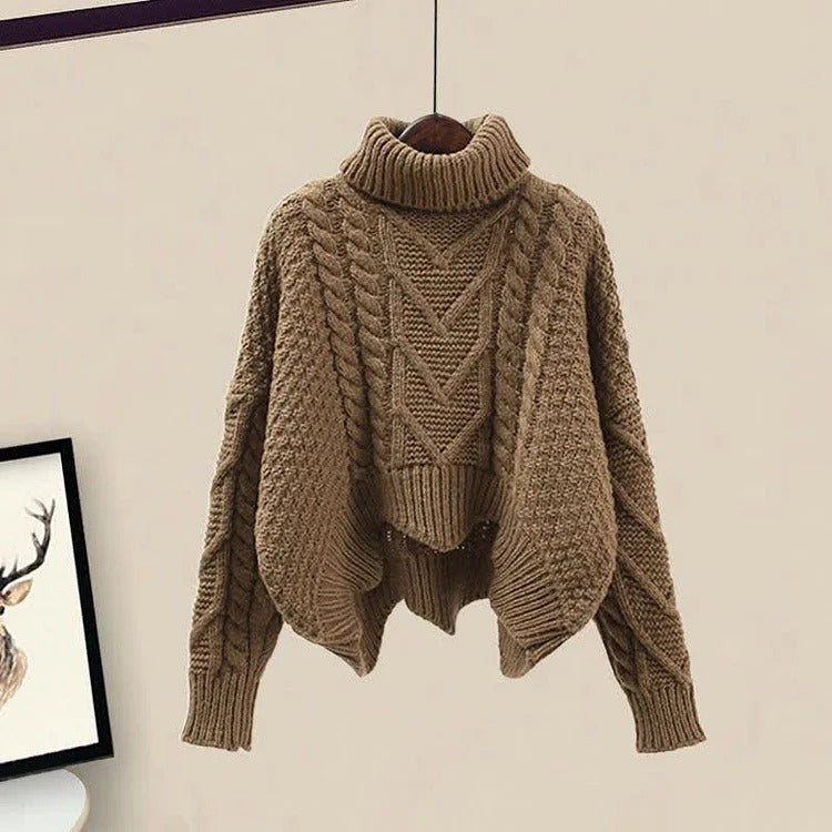 Coffee-colored oversized cable knit turtleneck sweater, cropped length, cozy and stylish.