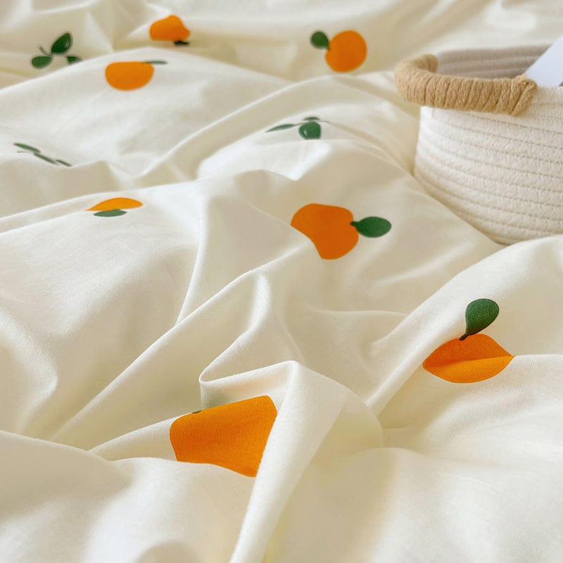 Cream cotton bedding set with cute orange fruit print, available in Twin, Full, & Queen sizes. Soft, breathable, & durable.