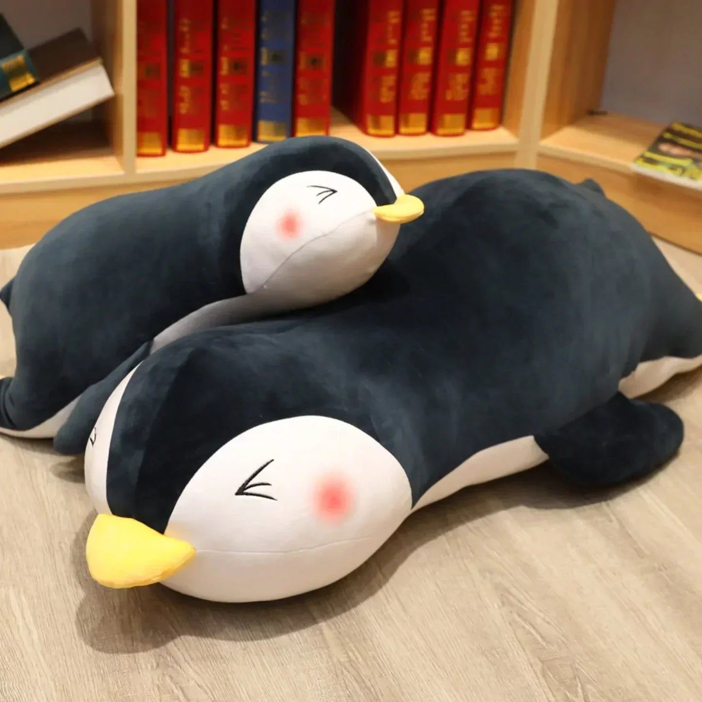 Dark gray penguin plush pillow, soft PP cotton, comfy, multiple sizes, promotes relaxation.