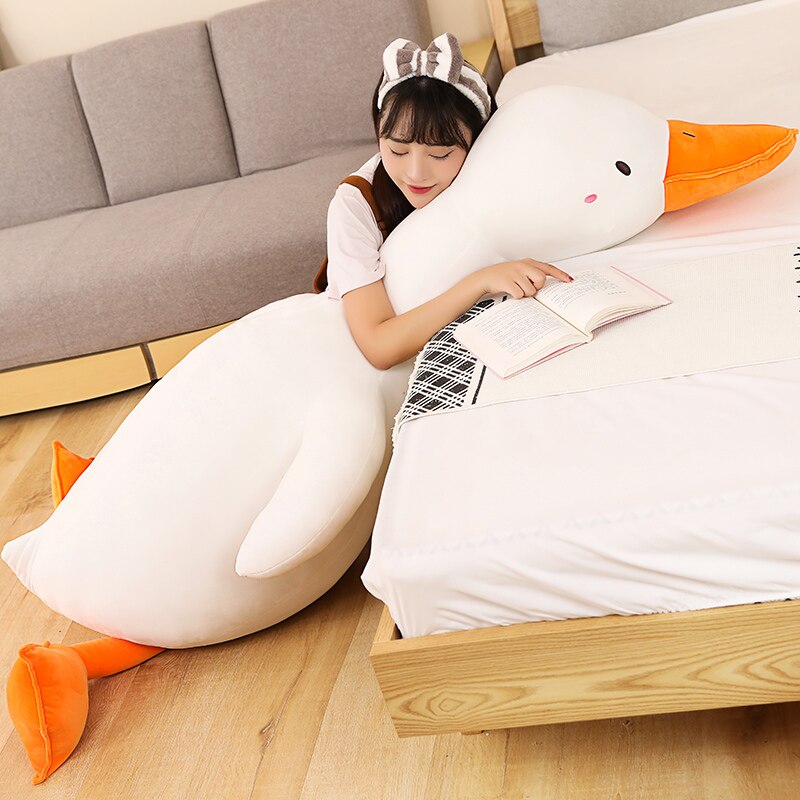 Giant Flora swan plush pillow, white with orange feet, premium PP cotton filling, hypoallergenic, promotes relaxation.