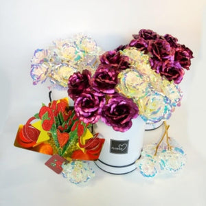 12 iridescent gold & purple galaxy roses in a white suede gift box with a 3D pop-up card. Perfect gift for any occasion.