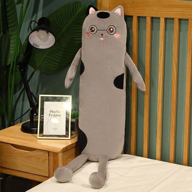 Gray plush cat body pillow with black spots, glasses, and soft PP cotton filling. Perfect for cuddling and sleep.