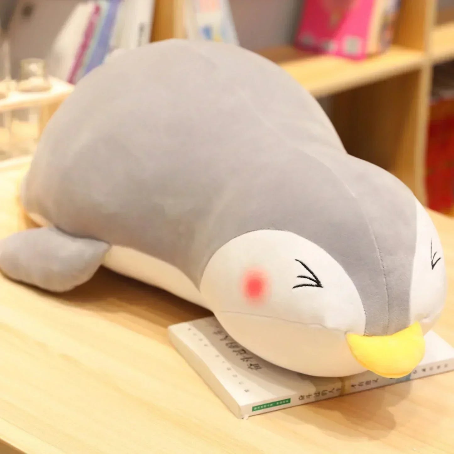 Adorable gray penguin plush pillow, soft PP cotton filling, perfect for snuggling.  Multiple sizes available.