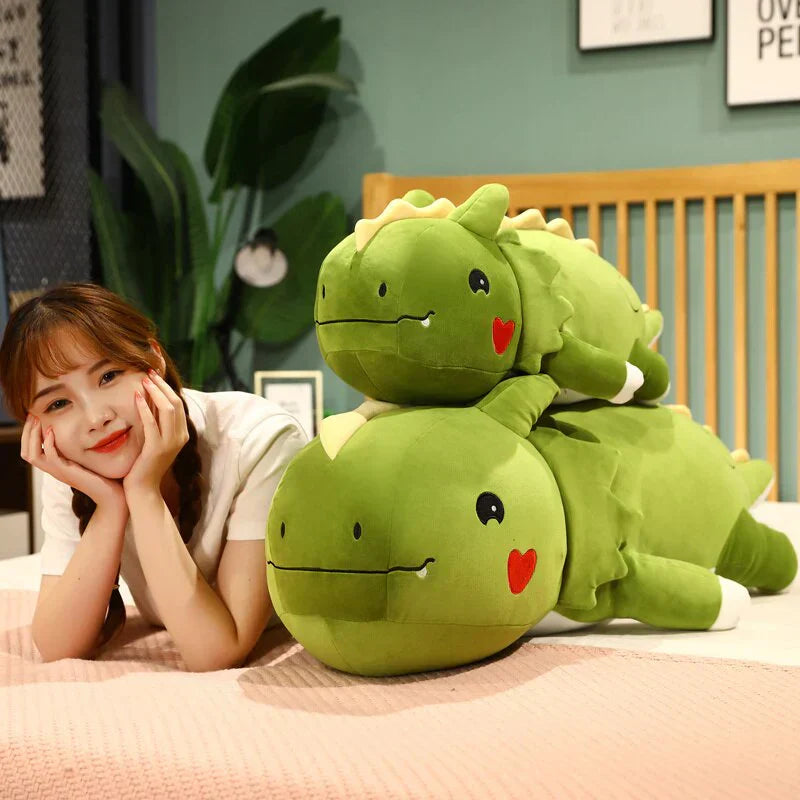 Two adorable green plush dragons, made of soft hypoallergenic cotton, perfect for cuddling.
