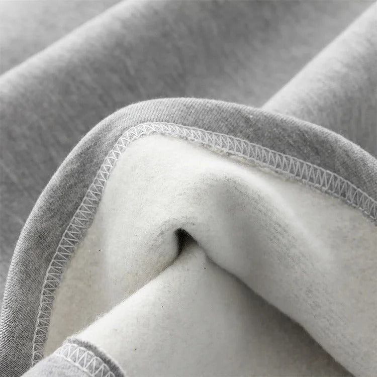 Cozy grey plush polyester Harajuku cat paw hoodie with cat ears. Features cute paw prints, soft lining, and various sizes.