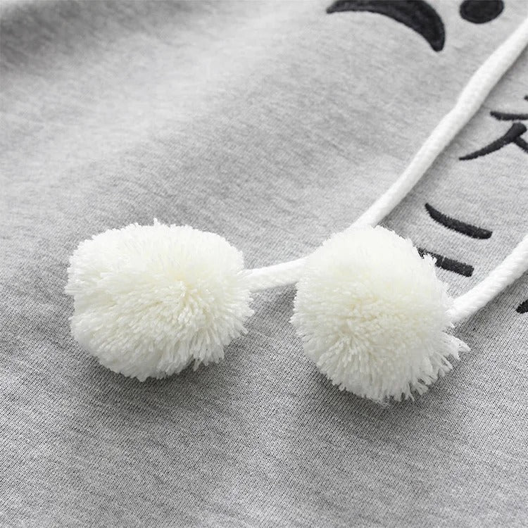 Grey Harajuku cat paw hoodie with plush fabric, cat ears, and white pom-poms.