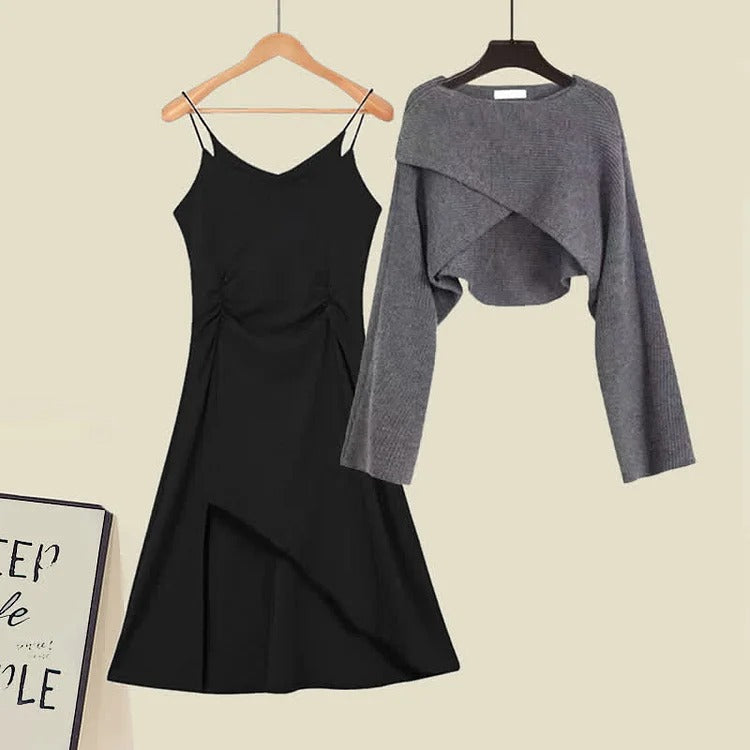 Grey knit cropped sweater and black asymmetrical slip dress set. Polyester, long sleeve, knee-length. Modern preppy style.