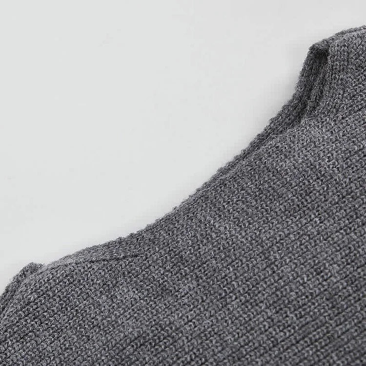 Grey knit sweater detail, long sleeves, cozy, part of a chic two-piece set with asymmetrical slip dress.