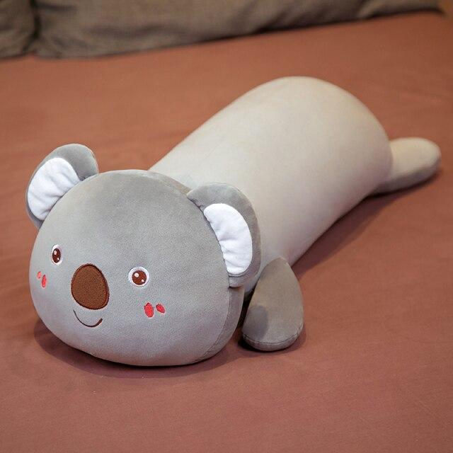 Adorable grey koala plush pillow buddy, made with soft PP cotton, perfect for cuddling and sleep. Ergonomic design for comfort.