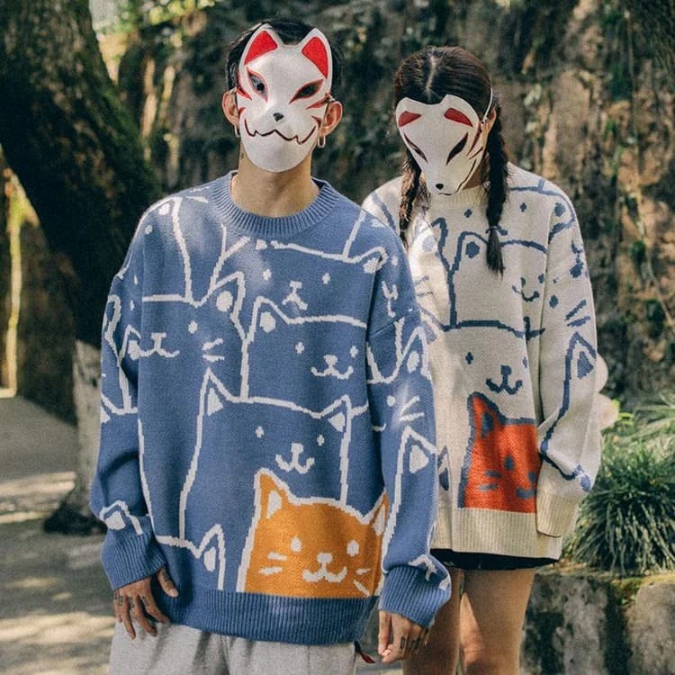 Harajuku style blue cotton sweater featuring an adorable cartoon cat design.  Long sleeves, round neck, comfy fit.