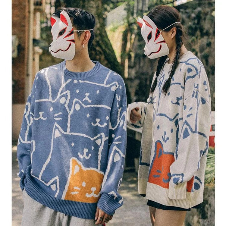Harajuku style blue cotton sweater featuring an adorable cartoon cat pattern.  Long sleeves, round neck, comfy and stylish.