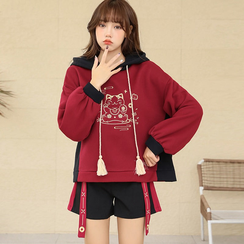 Red & black Harajuku lucky cat hoodie and mini skirt set; soft cotton blend, embroidered details, drawstring hoodie.