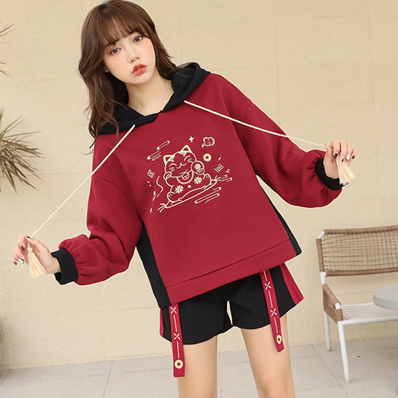 Red & black Harajuku lucky cat hoodie & mini skirt set; soft cotton blend, embroidered details.