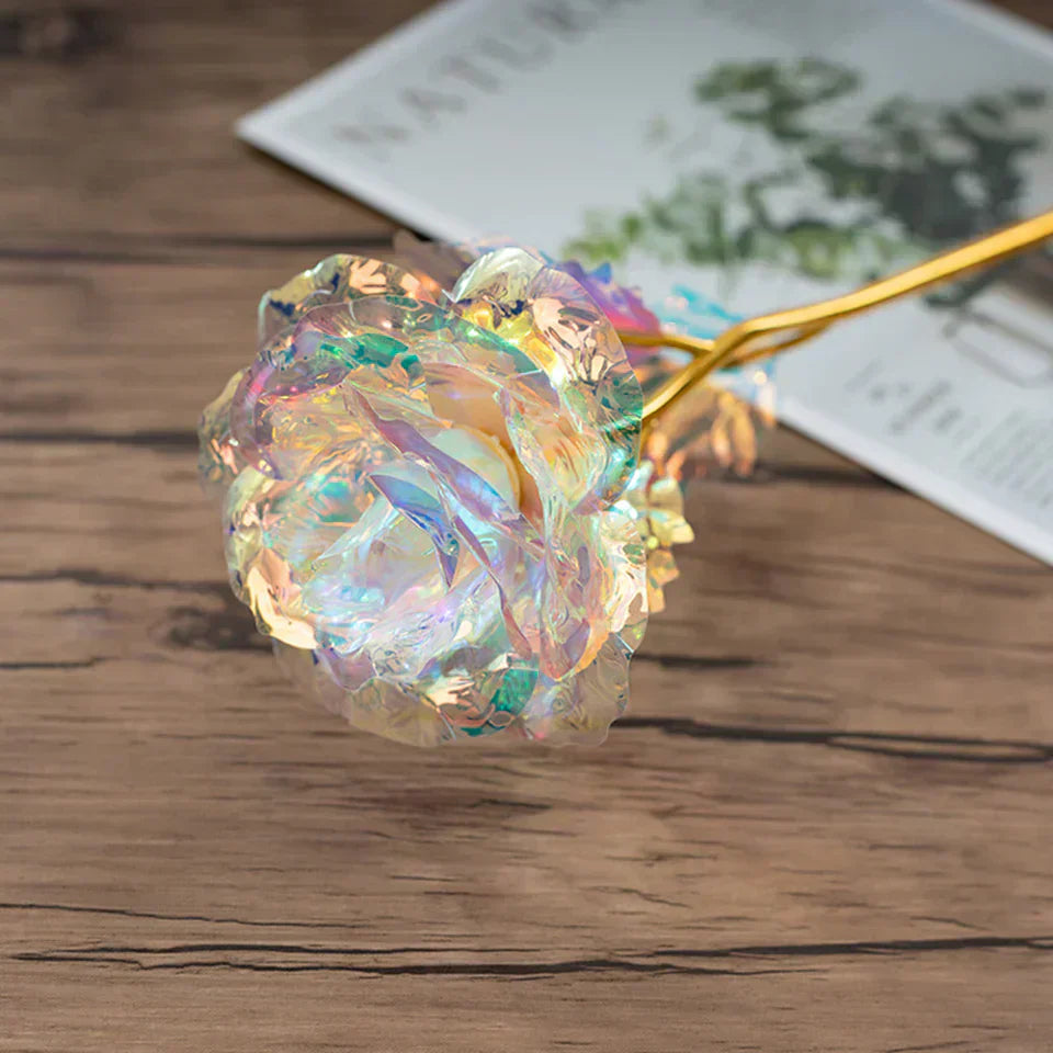Iridescent galaxy rose with 24k gold-plated stem, perfect gift for anniversaries or birthdays.  Comes with heart-shaped stand and gift box.