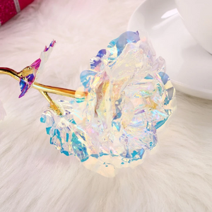 12 iridescent gold-dipped polyurethane galaxy roses in a white suede box with a 3D greeting card.  Perfect gift!