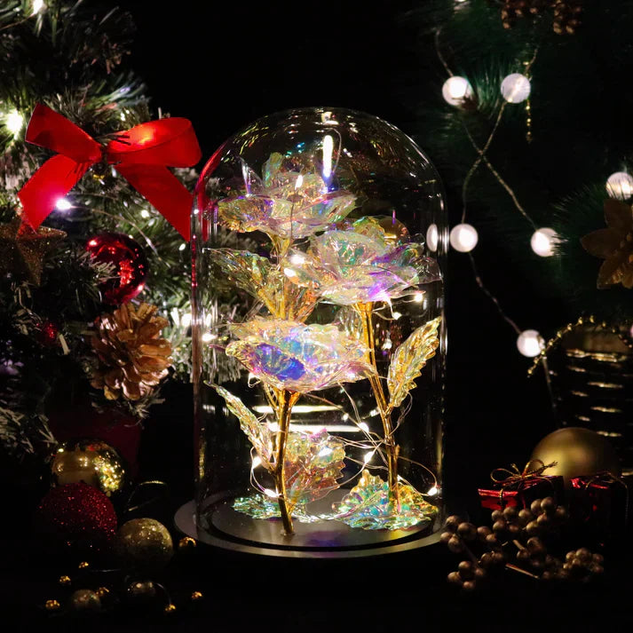 Iridescent LED rose in glass dome with warm lights, wooden base; perfect gift.