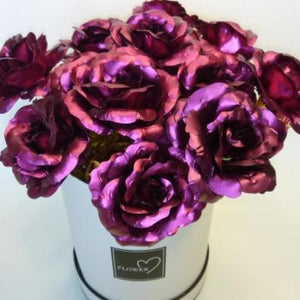 12 iridescent purple galaxy roses in a white suede gift box, 24K gold-dipped polyurethane, with 3D pop-up card.