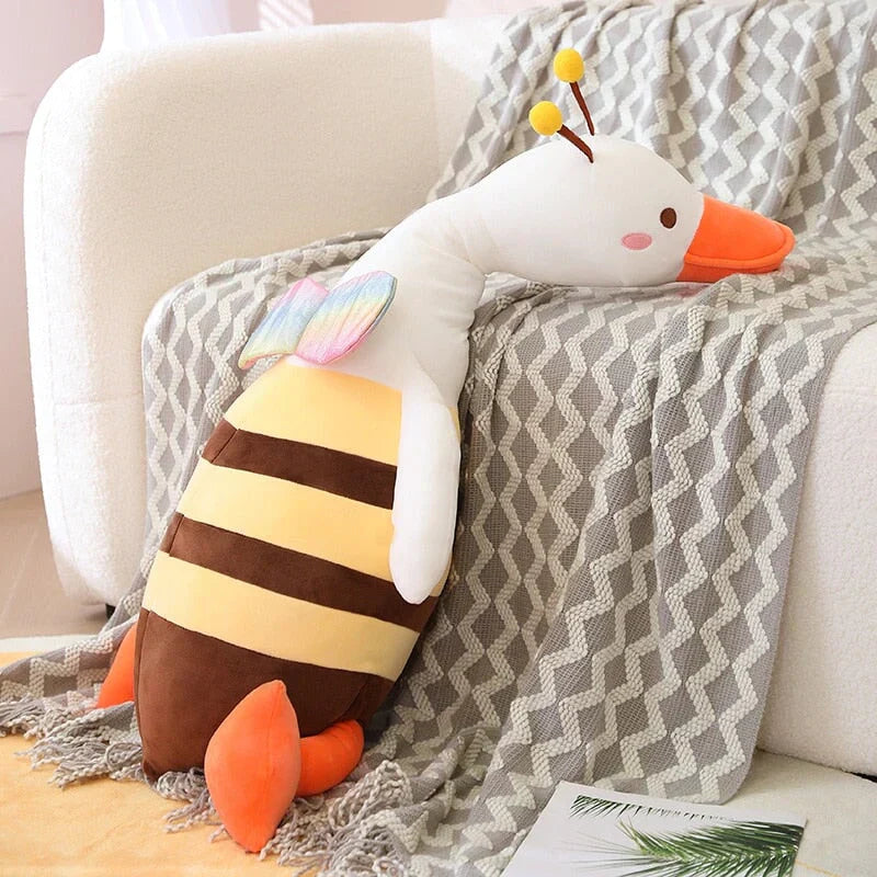 Kawaii half bee half swan plush toy with rainbow wings, PP cotton filling, and multiple sizes.  Soft & huggable.