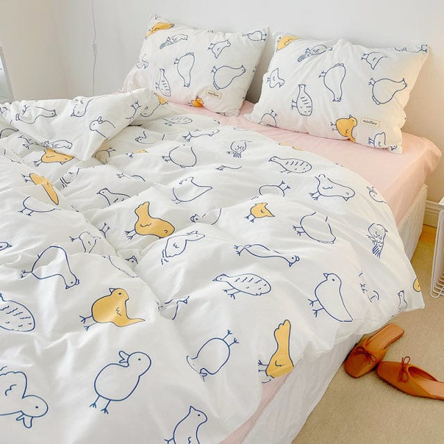 Kawaii bird cotton bedding set, featuring yellow & blue birds on white. Includes duvet cover, flat sheet & pillowcases. Twin, Full & Queen sizes.