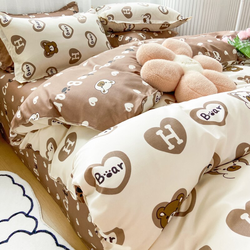Kawaii brown bear and purple duck reversible bedding set; includes duvet cover, flat sheet, and pillowcases.  Soft, premium polyester microfiber.