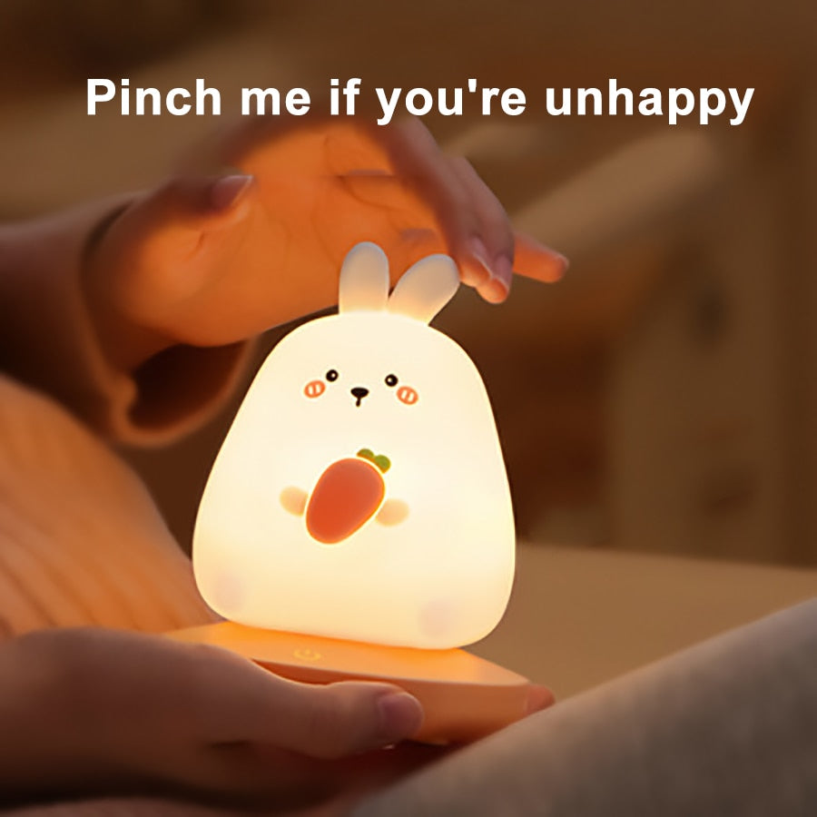 Kawaii bunny silicone night light, warm white LED, 3 brightness levels, USB rechargeable, 10-hour battery life.  Perfect for kids' rooms.